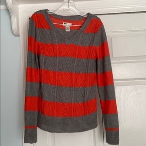 Red and gray striped sweater